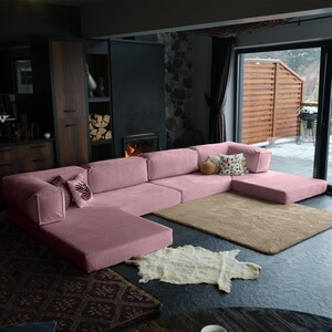 A soft teddy modular sofa with washable fabric and convertible closed corner. Its L-shaped miniature design fits perfectly in cozy living areas with flexible seating needs.