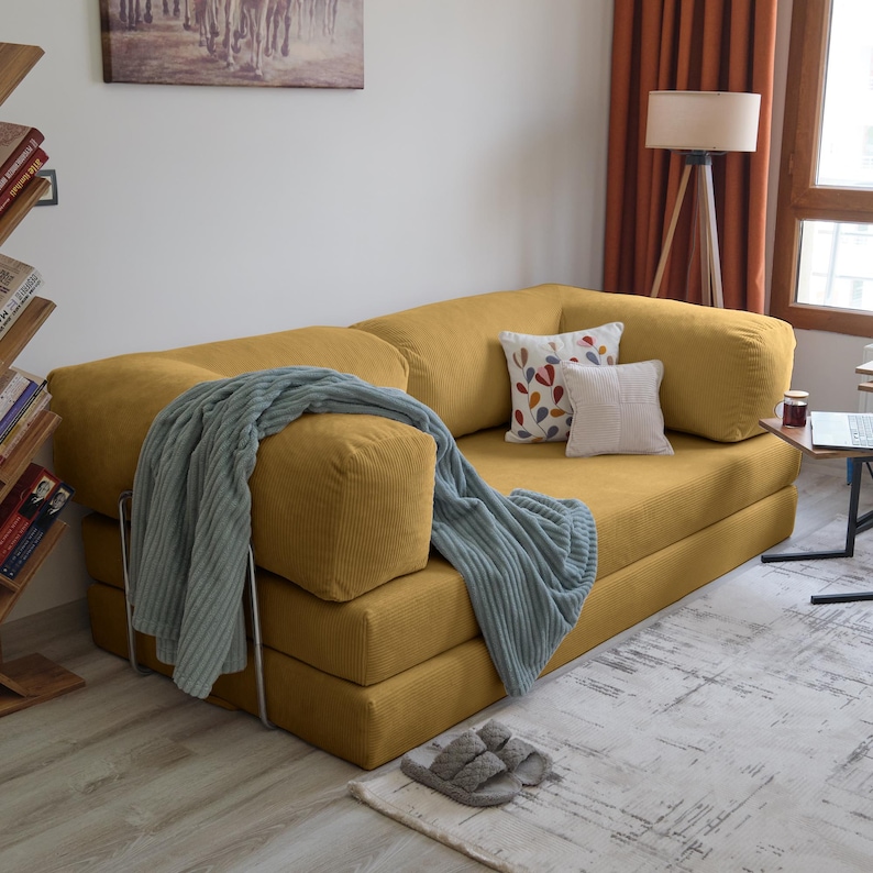 Teddy custom floor sofa styled low to the ground, offering relaxed comfort and modern elegance for minimalist living spaces.