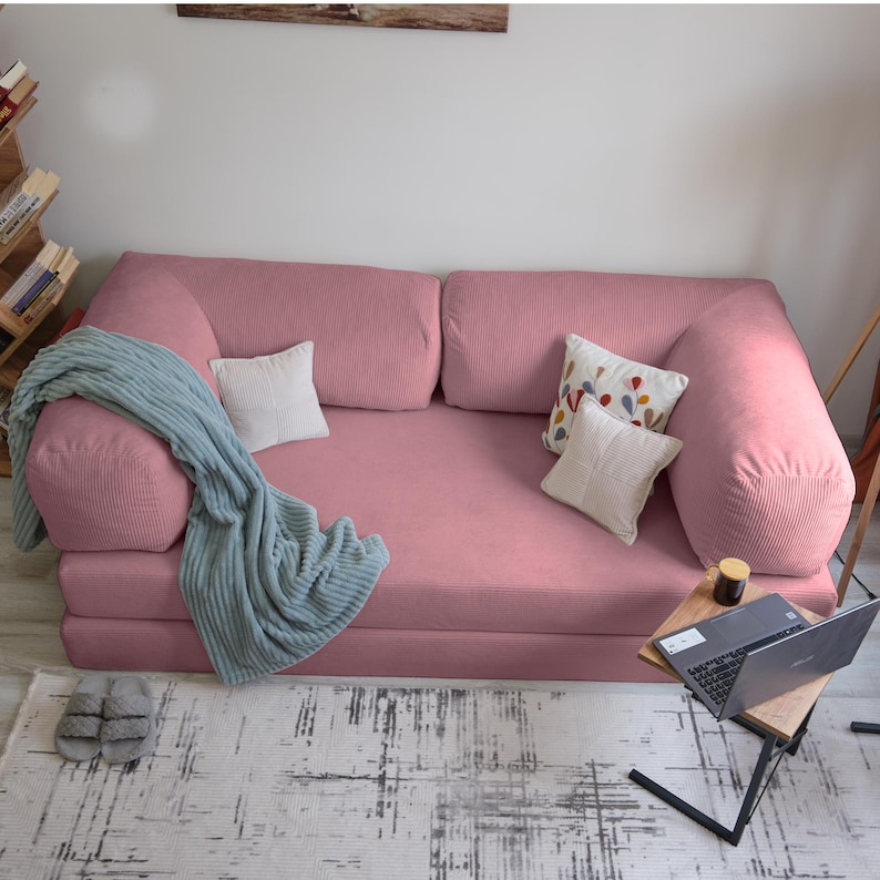 Teddy velvet sectional sofa bed styled in a corner setup, offering plush comfort and multifunctional use for family livingrooms.