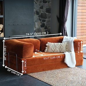 Closed teddy corner sectional arranged with pillows, offering modular flexibility and cozy seating for interiors.