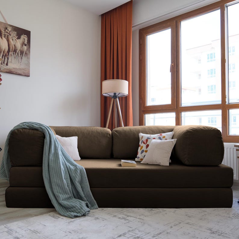 Teddy livingroom sofa bed styled in lounge and bed modes, offering multifunctional comfort and practical elegance for modern homes.