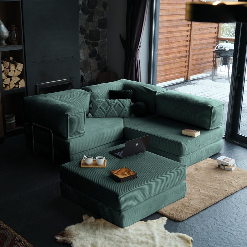 Corduroy teddy sofa displayed with layered cushions, blending durable texture with soft, inviting elegance for daily use.