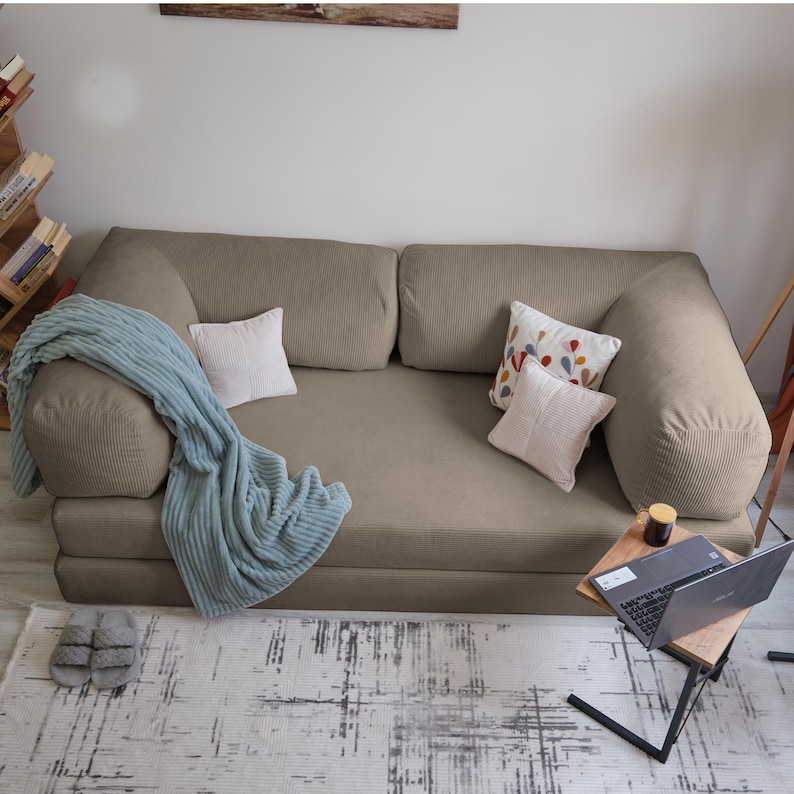 Teddy corduroy sofa styled in a modular corner layout, offering cozy seating with timeless texture for relaxed living rooms.