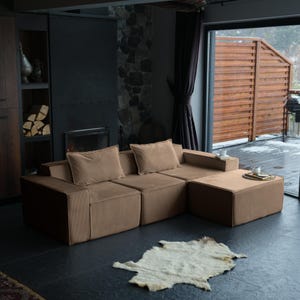 This minimalist teddy floor sofa offers clean design with cozy teddy softness. Featuring washable covers and a modular sectional structure, it’s perfect for stylish home living decor that values comfort.