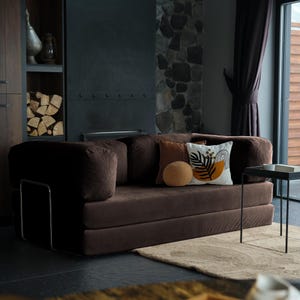 Washable teddy cushion sofa styled in natural light, highlighting practical design with timeless coziness.