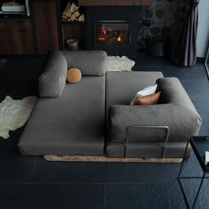 Plush teddy modular sofa transformed into a low guest bed, ideal for compact living rooms or homes that need flexibility without sacrificing style.