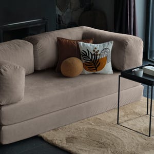 Luxury teddy sofa bed shown in sleep mode, providing a stylish and comfortable guest-ready solution.