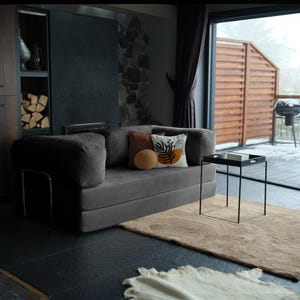 Custom washable teddy sofabed laid out flat for sleeping, showing how soft materials and smart design can turn everyday spaces into restful retreats.