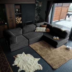 This miniature convertible teddy sofa combines handmade craftsmanship with modern corduroy softness. Perfectly sized for cozy spaces, it offers convertible comfort and a plush teddy feel.