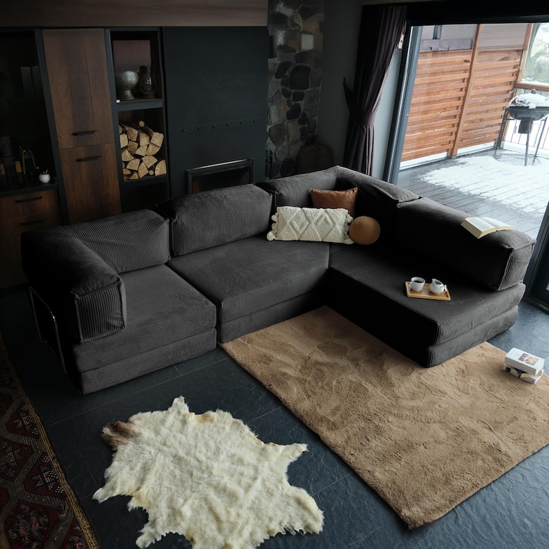 This miniature convertible teddy sofa combines handmade craftsmanship with modern corduroy softness. Perfectly sized for cozy spaces, it offers convertible comfort and a plush teddy feel.