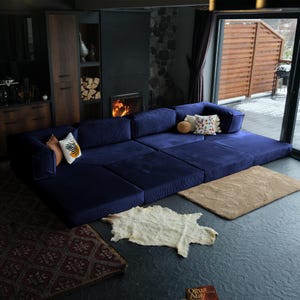 Designed with soft living in mind, this teddy sofa bed sits low to the ground for a relaxed floor feel. Wrapped in corduroy teddy fabric, it’s modular, washable, and endlessly comfy — a teddy couch made for cozy modern homes.