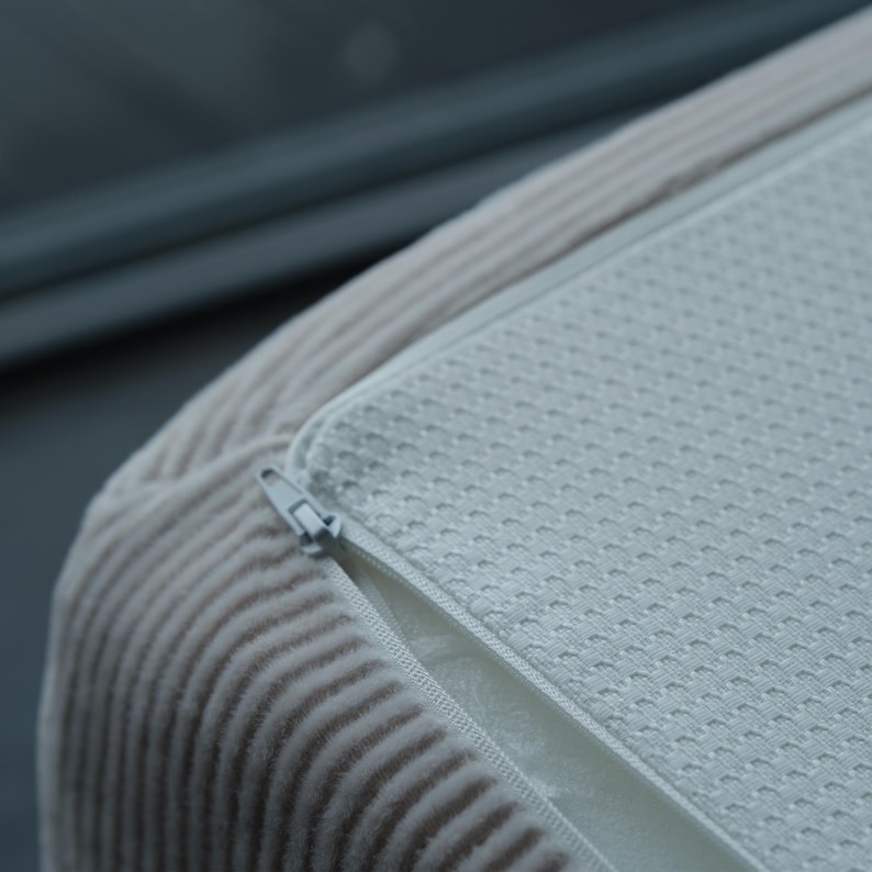 This corduroy teddy couch doubles as a sleeper with hidden folding structure, perfect for small apartments or multifunctional living rooms.