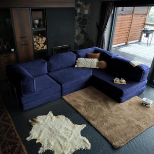 Experience all-day relaxation with this floor-level teddy sofa bed. Its soft corduroy teddy texture offers maximum comfort, while the modular structure fits any room. A washable and cozy teddy couch perfect for minimalist or laid-back interiors.