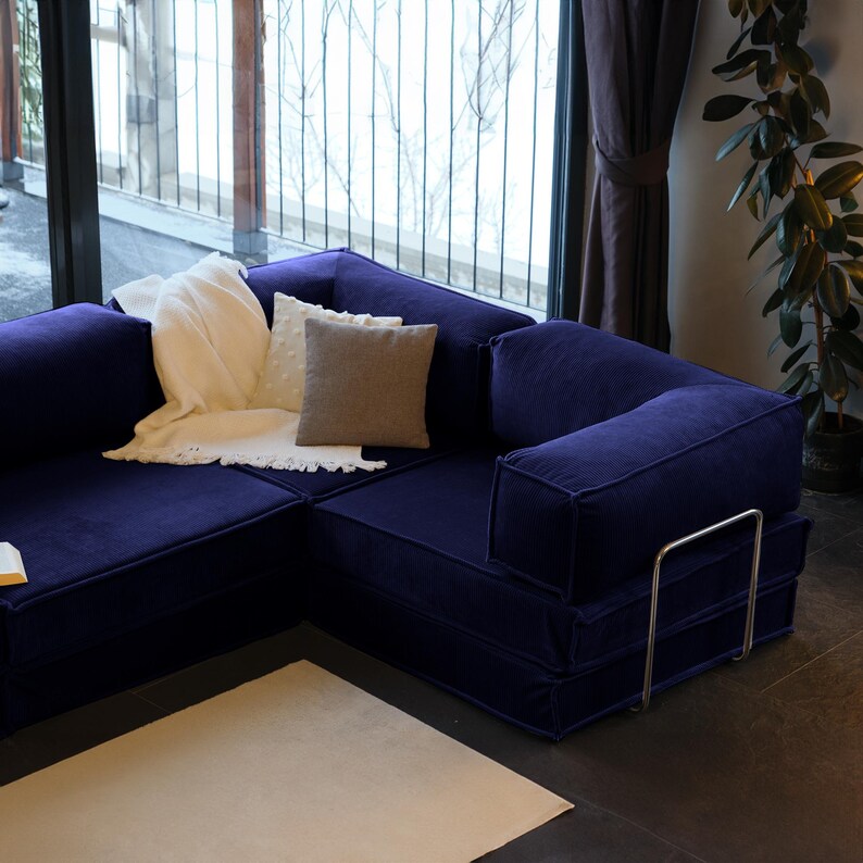 Enjoy the warmth of teddy fabric in this modular floor sofa bed. Washable and comfortable, it’s an ideal living room couch for modern, cozy homes.
