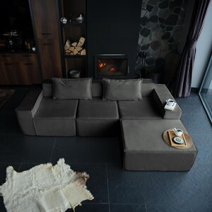 A soft teddy couch with a low, floor-friendly design. Washable and deeply cushioned, this modern sofa couch brings cozy texture and practicality to your home.