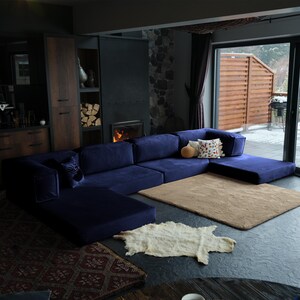 This teddy modular sofa bed redefines relaxation with its floor-level structure and corduroy teddy softness. Perfect for lounging, napping, or movie nights, its washable covers and modern design make it a true teddy essential.