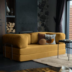 Modern teddy floor sofa bed arranged in lounge and bed modes, showcasing multifunctional design for compact or large homes.