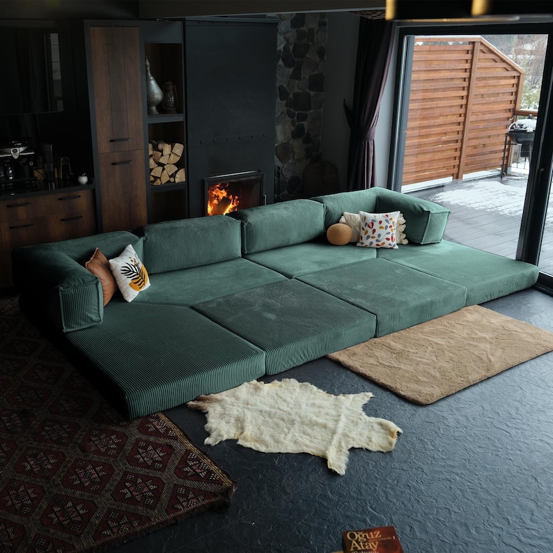 Soft teddy sofa arranged with rugs and throws, combining plush texture and cozy sophistication for contemporary interiors.