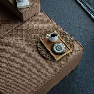 This washable teddy sofa offers the best of both worlds: minimalist style and floor-level comfort. Soft teddy fabric and sectional design make it a versatile piece for home living decor.