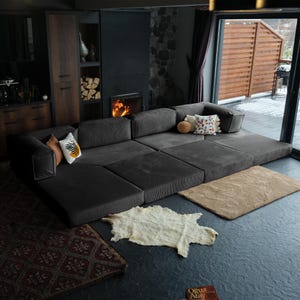 Experience plush teddy softness with this handmade L-shaped miniature sofa. Convertible design and modern corduroy fabric make it both functional and cozy.