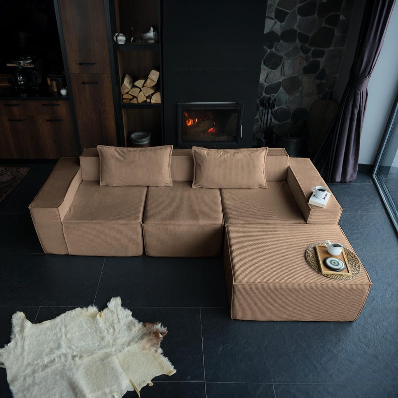 Designed with teddy softness in mind, this minimalist floor sofa features plush cushions and washable fabric. A sectional layout brings flexibility and comfort to your home living decor.