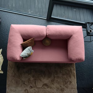 Closed teddy corner sofa styled low to the ground, combining grounded design with plush comfort for compact spaces.