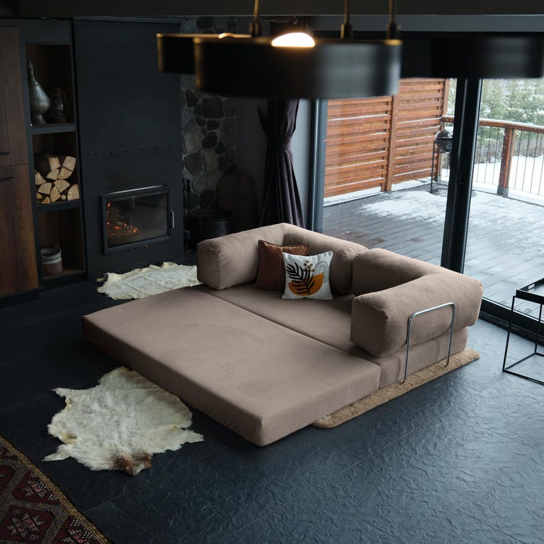 Modular corner teddy couch styled with layered pillows and rugs, creating a warm, inviting focal point in the room.