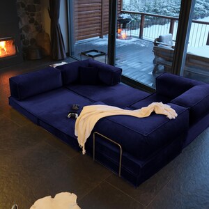 Soft teddy textures cover this modular floor sofa bed, designed for easy cleaning and maximum comfort in your living room couch.