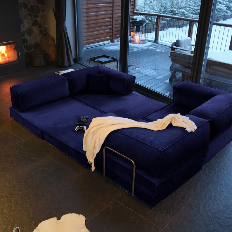 Soft teddy textures cover this modular floor sofa bed, designed for easy cleaning and maximum comfort in your living room couch.