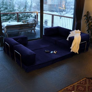 This washable teddy sofa bed combines modular functionality with soft, plush fabric. Perfect as a living room couch that adapts to your needs.