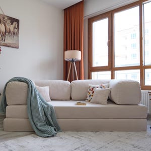 Comfortable sectional teddy sofa styled in a bright, cozy living room with plush cushions and soft lighting, perfect for relaxing evenings or casual hosting.