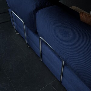 Plush teddy fabric wraps this structured foldable sofa, creating a seat that supports your back while offering softness and flexibility when opened.