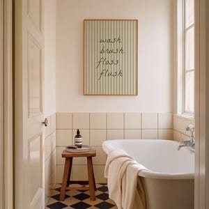A printable striped "wash brush floss flush" sign, styled as trendy aesthetic bathroom decor.