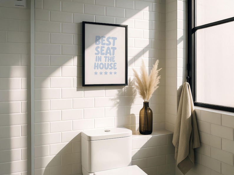 Printable wall art says "Best Seat In The House" , displayed above a toilet.