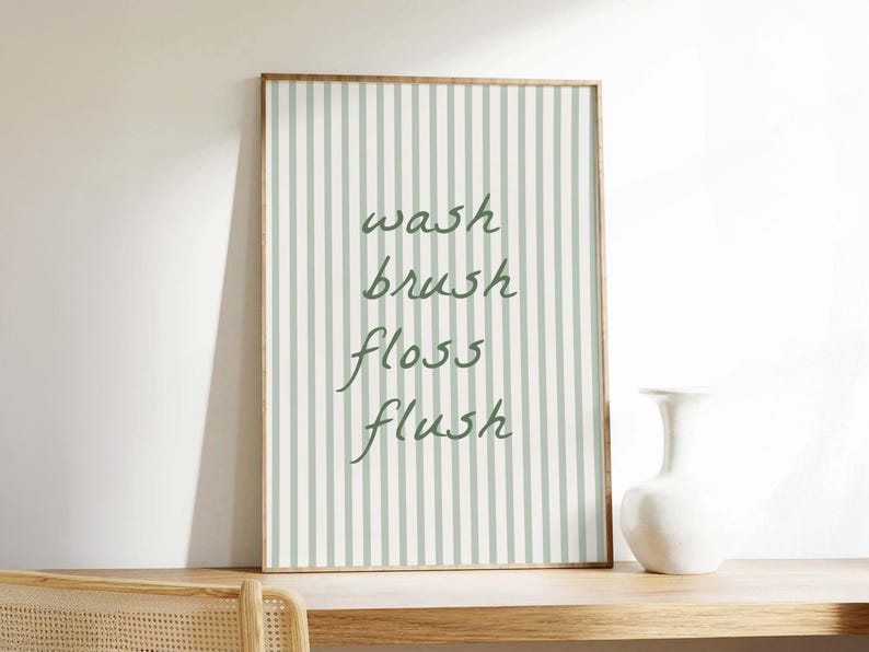 A printable striped "wash brush floss flush" sign, styled as trendy aesthetic bathroom decor.
