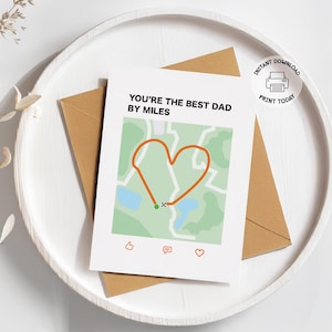 May include: A white greeting card with the text "YOU'RE THE BEST DAD BY MILES" and a map design with an orange heart shape. The card is on a brown envelope, placed on a white tray. A sticker reads "INSTANT DOWNLOAD PRINT TODAY".