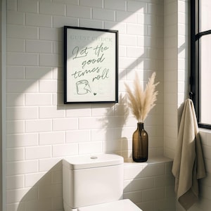 A printable "Let the good times roll" sign, styled above a toilet.