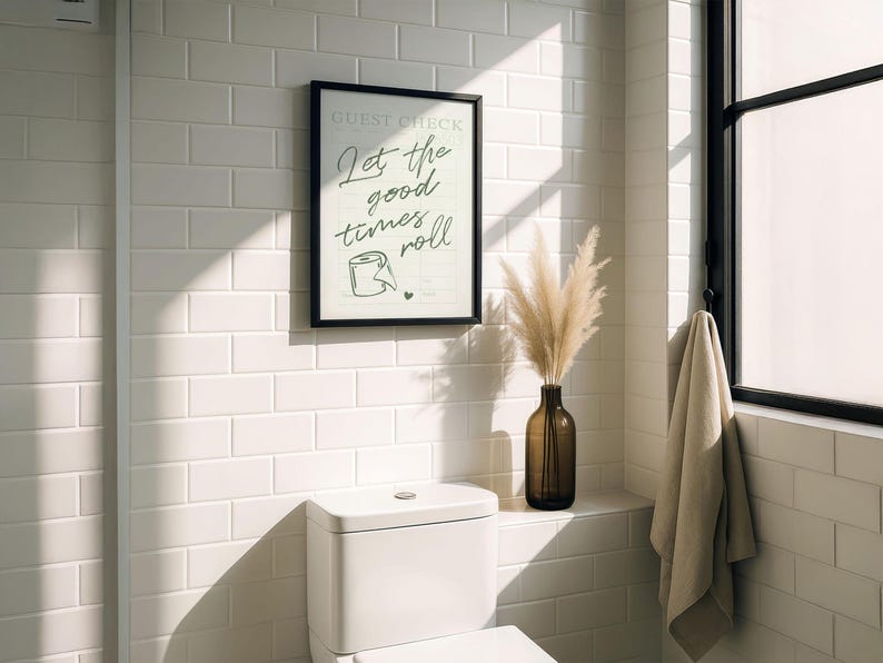 A printable "Let the good times roll" sign, styled above a toilet.
