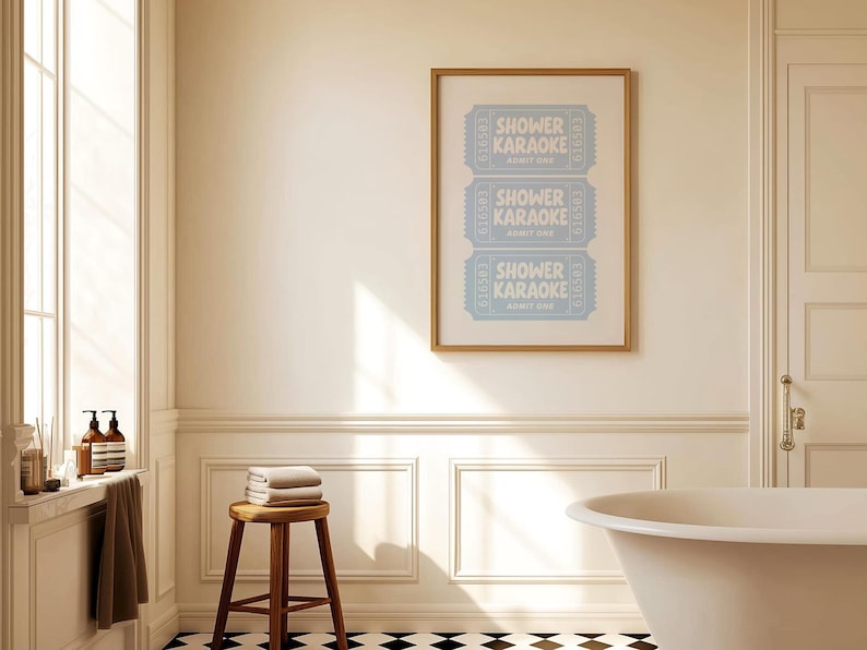 Printable wall art says "Shower Karaoke" , displayed above a bathtub.