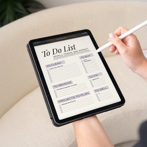 Sunday Reset Digital Planner displayed on iPad. It's the perfect Weekly Cleaning To Do List. This Printable Chore Checklist is Editable and makes keeping your home tidy an easy and fun routine. ADHD friendly and perfect for busy moms.
