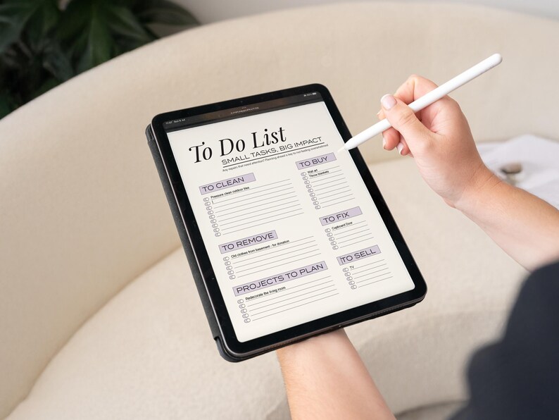 Sunday Reset Digital Planner displayed on iPad. It's the perfect Weekly Cleaning To Do List. This Printable Chore Checklist is Editable and makes keeping your home tidy an easy and fun routine. ADHD friendly and perfect for busy moms.
