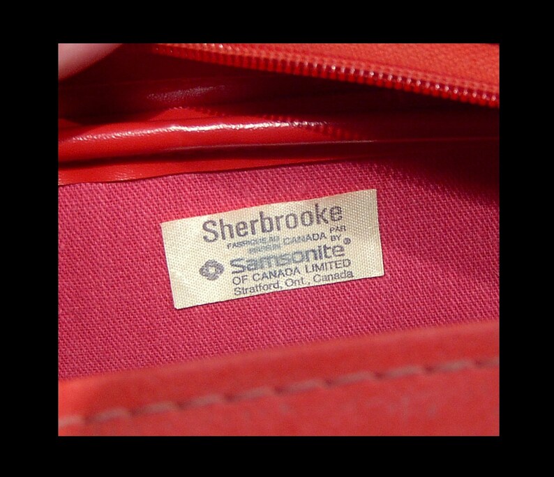 1970s hot pink red Samsonite Canada carry on flight bag suitcase w long adjustable strap ~ top zipper ~ vinyl travel duffel case gym duffle