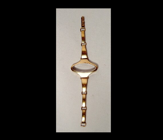 Ladies mid century gold tone metal space age watch
