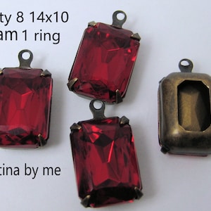 May include: Eight red glass 14x10 mm rectangular pendant charms with a brass ring and patina finish.  Qty 8 14x10 Siam 1 ring patina by me.