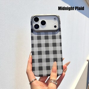 May include: A phone case with a black and white checkered pattern. The case has a silver-colored camera frame and the text "Midnight Plaid" in the upper right corner. The case is held by a person.