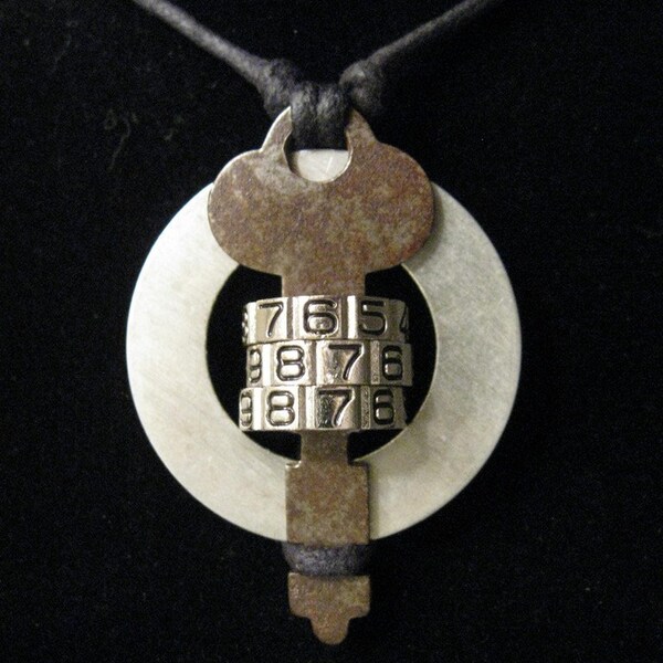 urban artifact necklace with vintage key, matte washer, luggage lock number dials