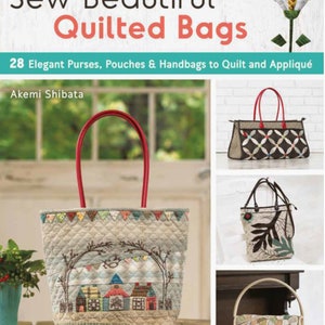 May include: Sew Beautiful Quilted Bags book cover featuring 28 elegant purses, pouches, and handbags to quilt and appliqué. The cover features a quilted tote bag with a red handle and a whimsical appliqué of a town with houses and trees.