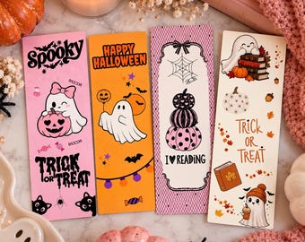 May include: Four rectangular paper bookmarks featuring Halloween themes. The first is pink with a ghost and pumpkin. The second is orange with a ghost and bats. The third is white with stacked pumpkins and a spiderweb. The fourth is white with a ghost, books, and the text Trick or Treat.