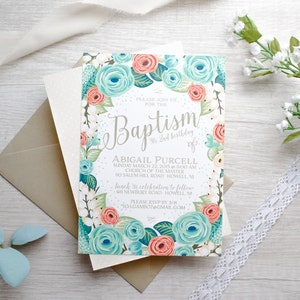 May include: A floral baptism invitation with a light blue and coral color scheme. The invitation features a wreath of flowers and the text "Please join us for the Baptism of Abigail Purcell 2nd birthday of".