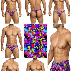 Op de afbeelding: Een set herenondergoed in verschillende stijlen, met een kleurrijke abstracte print met geometrische vormen en verfspatten. De print is in tinten roze, paars, blauw, groen en zwart.